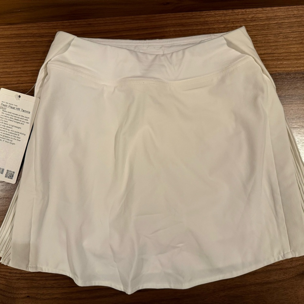 Lululemon size 0 Peek Pleat Tennis Skirt, white. New with tags!!